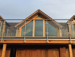 Glass and Steel Balcony with decking Worcestershire