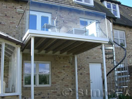 Infinity Glass Balcony with spiral staircase in Hexham